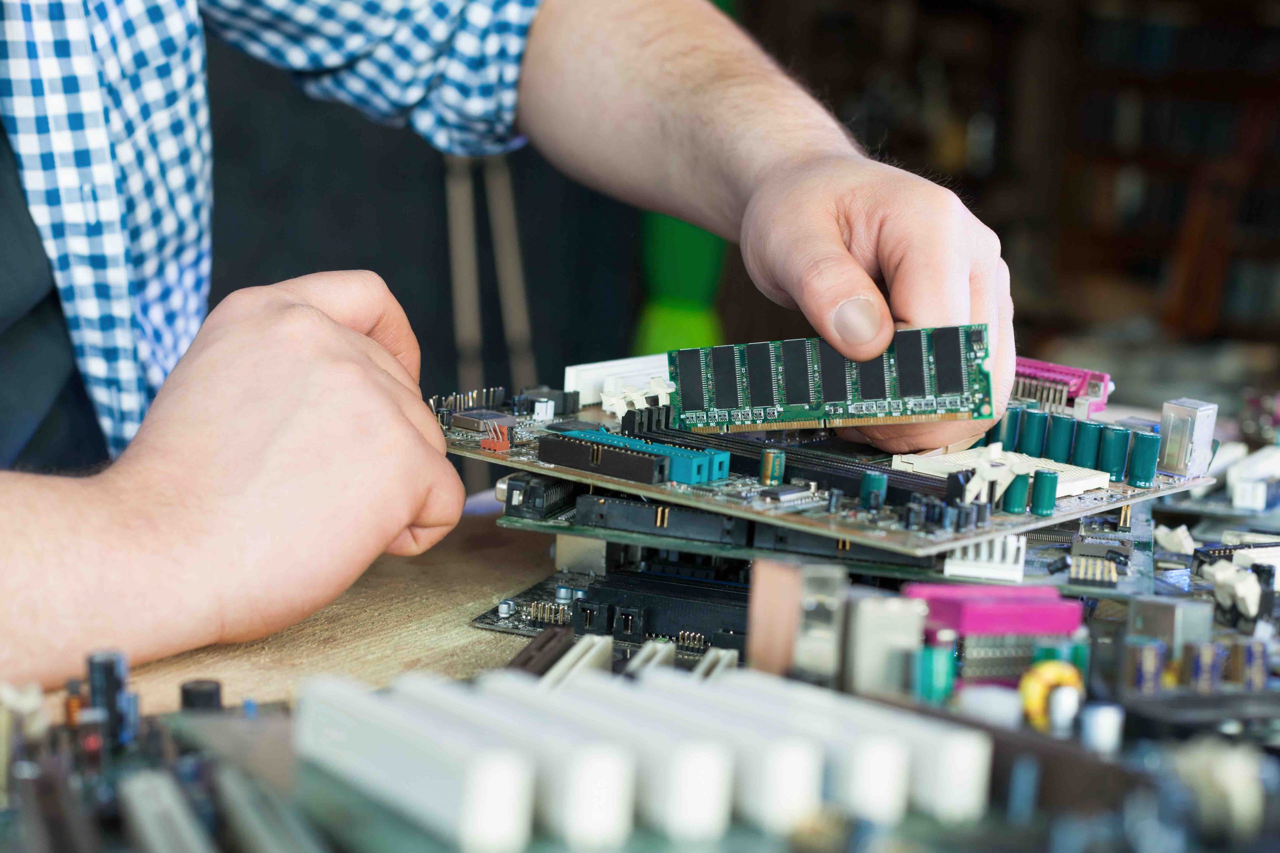 Service engineer work with computer motherboard